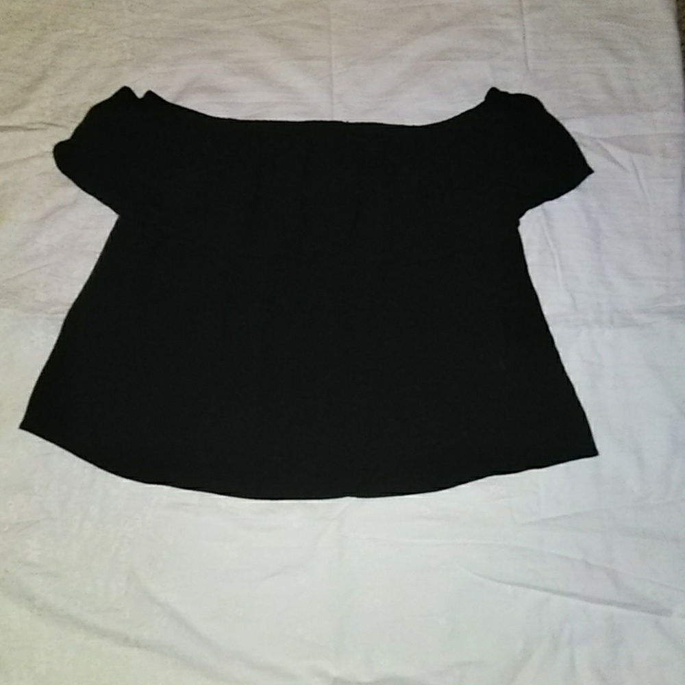 Black top can be worn off the shoulders